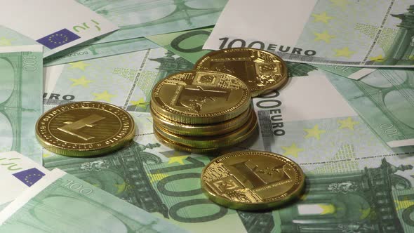 Lightcoins LTC Coins Rotating on Bills of 100 Euro Banknotes. Worldwide Virtual Internet alt
