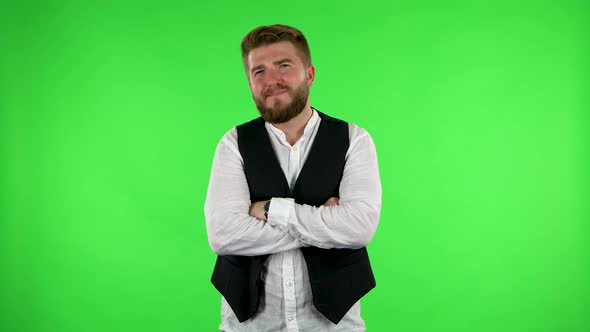 Guy Listens Carefully with a Smile and Then Waves His Finger. Green Screen alt