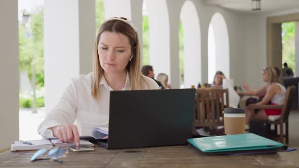 Business Woman with Calculator and Laptop Counts Incomes Expenses or Taxes RED alt