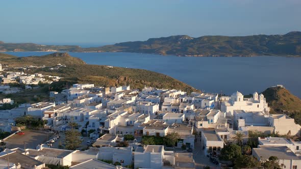 Panoramic View of Plaka Village with Traditional Greek Church. Milos Island, Greece alt