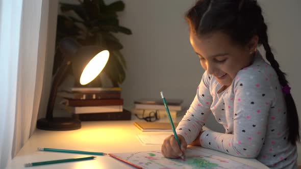 Cute Smart Primary School Child Girl Learning Writing Doing Math Homework Sit at Home Table Adorable
