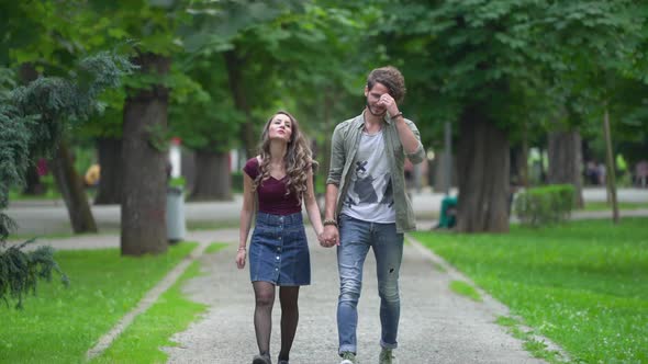 Couple walking on an alley alt