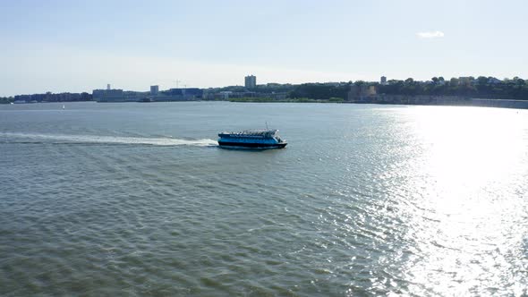 Aerial Tracking Shot of Ferry on the Hudson River in New York City 