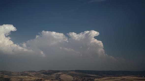 8K Fading Clearing Cumulus Clouds on Steppe Hills