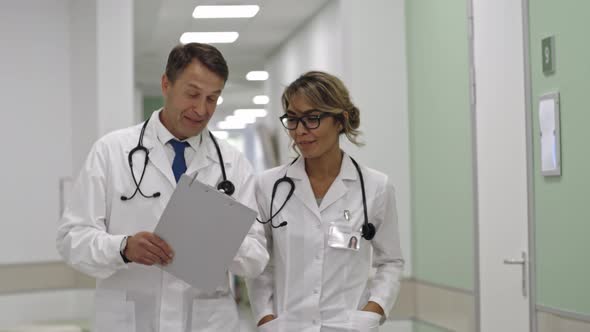 Healthcare Professionals Walking together in Hospital alt