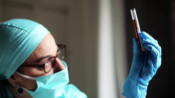 Doctor holding a coronavirus COVID-19 test tube