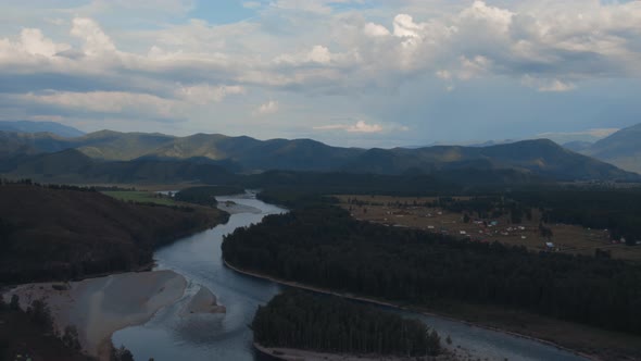 Majestic river Katun in valley of Altai under dramatic sky