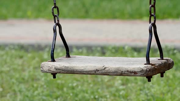 Empty Swing On The Chain