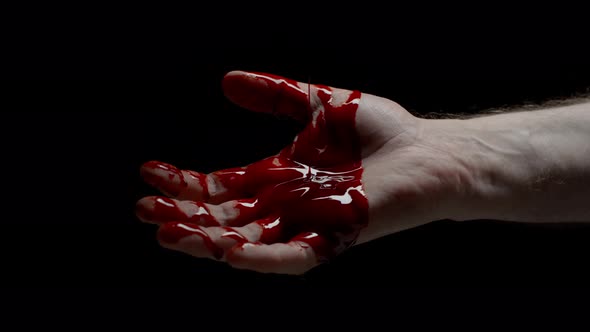 Closeup Caucasian Male Hand Covered in Blood Crime Scene Bloody Hand Isolated on Black Background alt