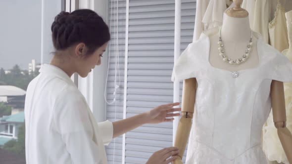 Future Bride Choosing Wedding Dress for Her Upcoming Wedding Ceremony alt