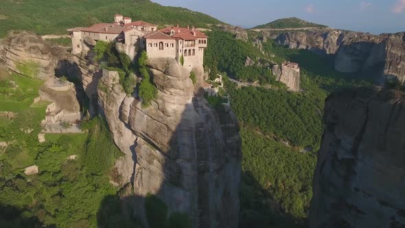 Drone view of Varlaam Monastery and Meteora rocks in Greece alt