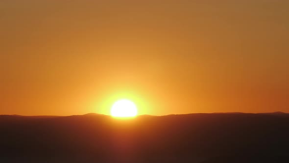 Golden Sun Over Horizon Time Lapse Zoom Out