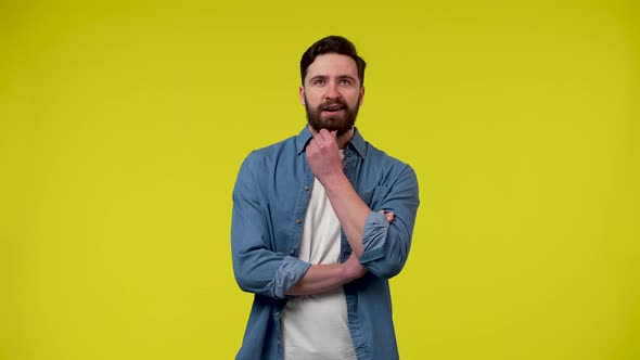 Portrait of a Man Thinking Intently Rubbing His Hands Then Rests His Hand on His Chin and Finds a alt