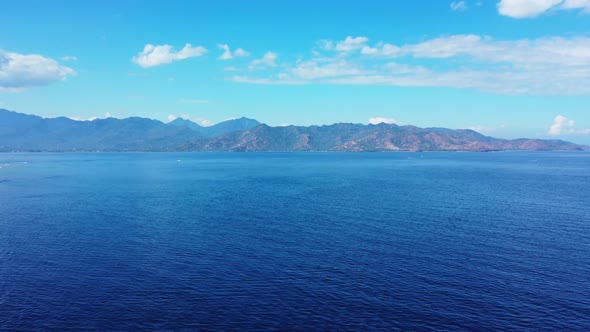 Aerial above seascape of idyllic island beach time by shallow sea and white sandy background of a da alt