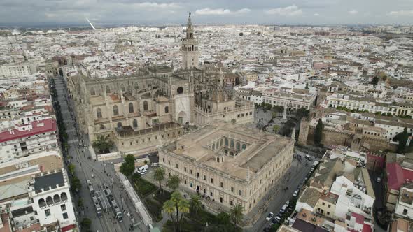 Stunning Seville Cathedral with distinctive Gothic architecture; aerial pan