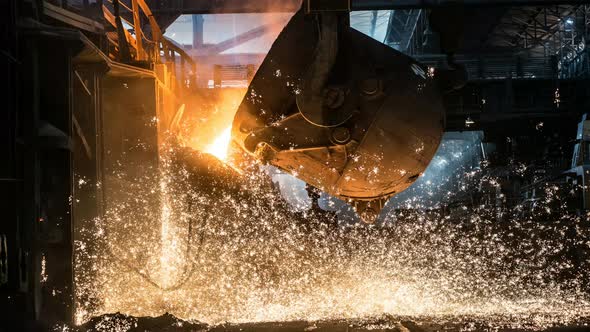 Pouring of liquid metal in open-hearth furnace. Cinemagraph. alt