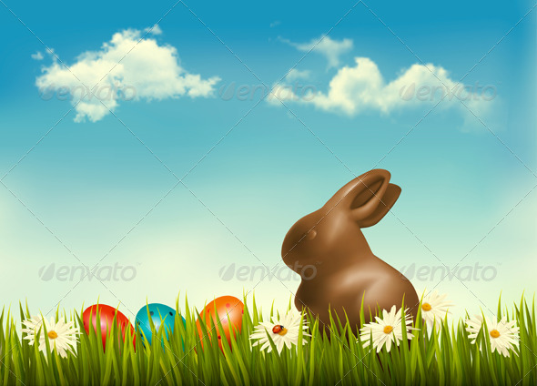 Chocolate Bunny with Easter Eggs in Grass - Seasons/Holidays Conceptual