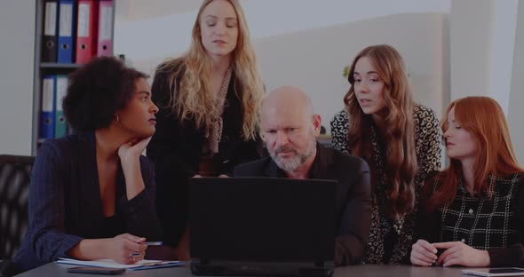 Angry Manager Discussing with Colleagues in Meeting alt