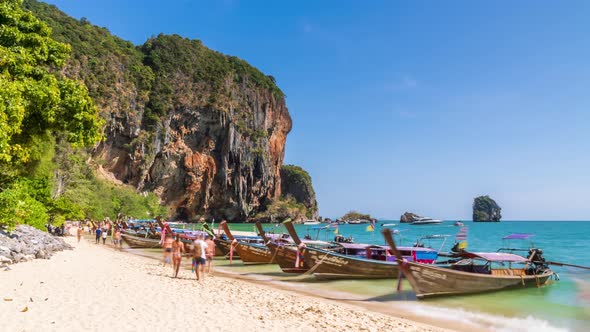 Phra Nang Beach with longtail boat and limestone cliff mountain, Krabi, Thailand - Time Lapse