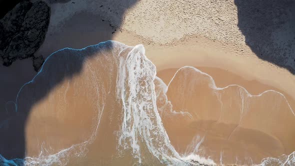 Aerial footage of the cliffs and beach in Sagres Portugal.
