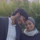 Happy Arabic Couple Standing Outdoor and Looking at Each Other - VideoHive Item for Sale