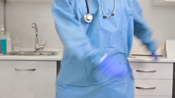 Positive Female Doctor Dancing Floss Dance in Hospital Celebrating the End of Coronavirus Pandemic alt