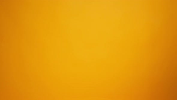 Human Hands Holding Cardboard Box with Coronavirus Donations Against Yellow Background alt