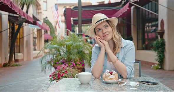 Pretty Woman Is Daydreaming in Street Restaurant at Old Historic Town in Europe alt