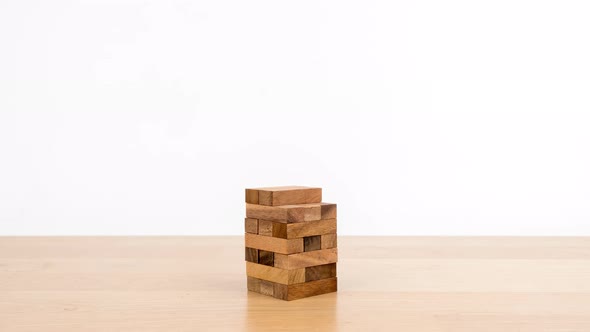 Stop motion animation Game with wooden blocks on white background