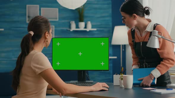 Busniess Woman Talking with Young Collegue About Internet Network alt