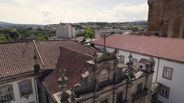 Main facade of the Misericordia Church against Castelo de Chaves, Portugal. Aerial shot alt