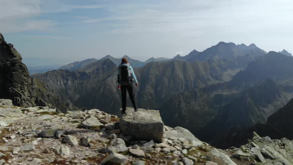 Girl Hiker Standing on Cliff in Front of Tatra Mountains National Park in Slovakia