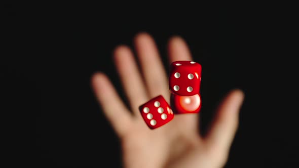 Three red dice are tossed and caught