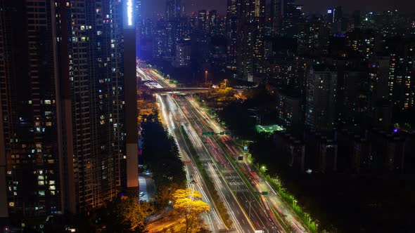 Timelapse Shenzhen Vehicles Drive Along Wide Highway alt