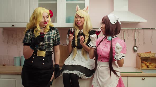 Carefree Lovely Multiracial Women in Costumes Having Fun During Cosplay Party alt