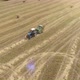 Aerial Footage of Tractor Produces Hay Harvesting - VideoHive Item for Sale