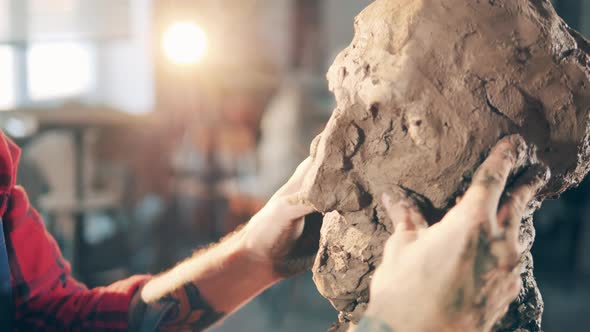 Clay Sculpture is Getting Molded By a Male Artist alt