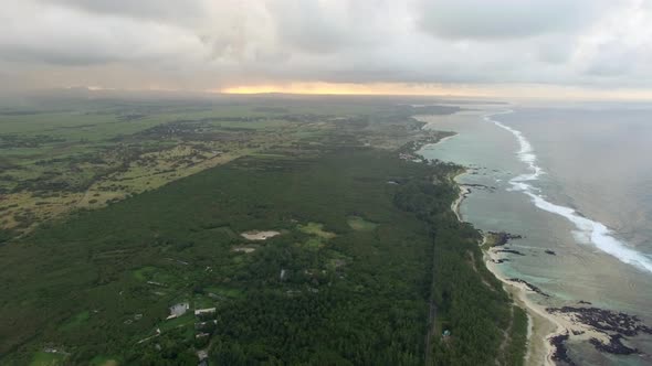 Aerial Bird Eye View of Coast with Sand Beach and Palm Trees and Water of Indian Ocean, Mauritius alt