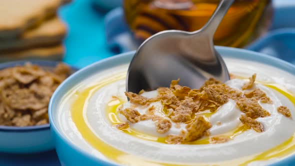 Yogurt with granola and honey, bowl of fresh and healthy breakfast