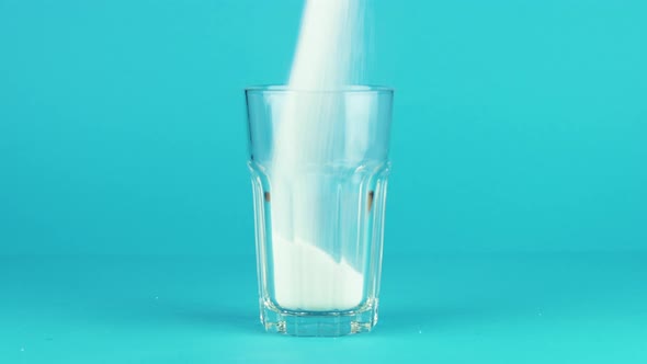 Pour Sugar Collins Glass Thick Bottom Blue Contrasting Background. Concept alt