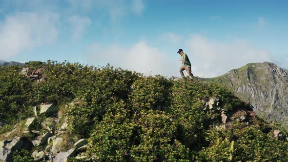 Aerial view; drone moving over young man