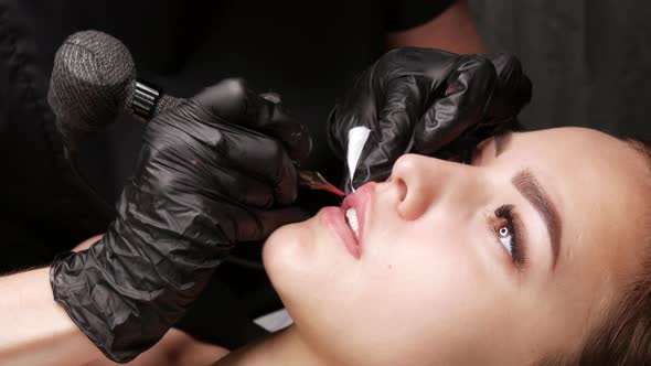 Microblading Lip Tattoo with Special Coloring Red Pigment That Corrects Lip Color in Cosmetology alt