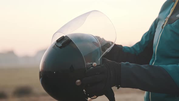 Glider Checking His Safety Helmet with Windshield alt