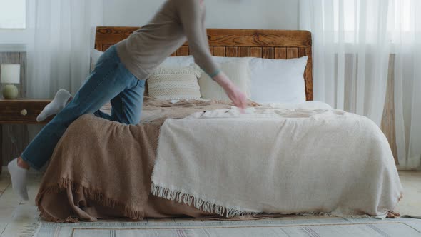 Exhausted Bored Young Woman Falling Down on Bed in Bedroom alt