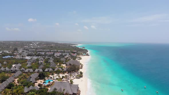 Aerial Paradise Sandy Beach with Turquoise Ocean and Luxury Hotels in Zanzibar alt