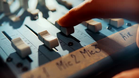 Recording Studio Production. Man Working On Professional Digital Audio Channel Mixer. alt
