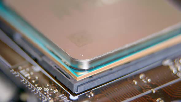 Computer Assembling the CPU is Placed on the Motherboard and Attached alt