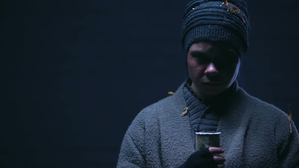 Beggar Showing Paper Cup Into Camera, Asking for Money and Donations, Charity alt
