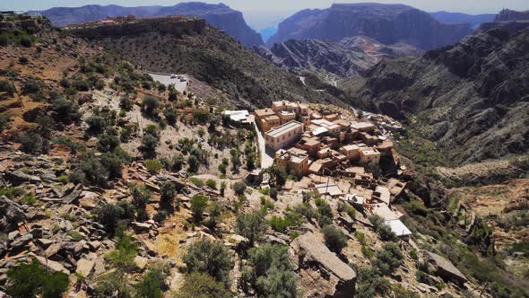 Scenic View of Small Rural Settlement at Jebel Akhdar Gorge in Al Hajar Mountains in Oman alt