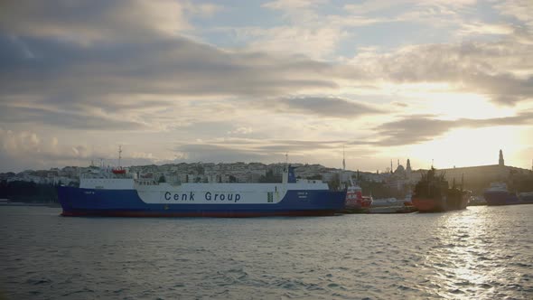 A Huge Cargo Ship is at the Shore alt